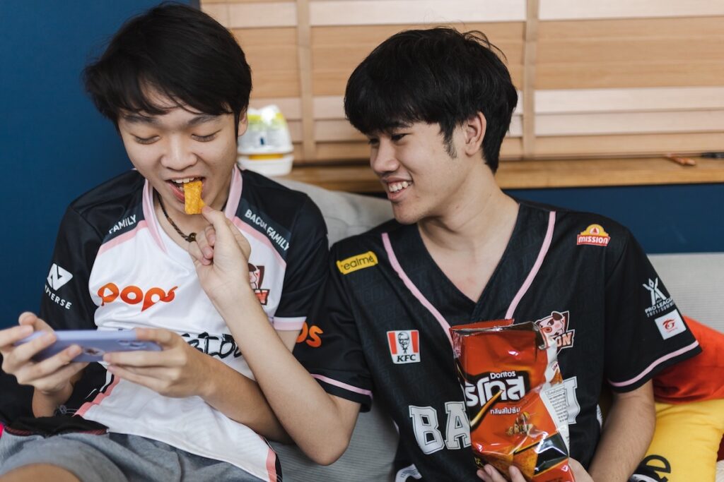 Thai professional esports team Bacon Time, which emerged victorious in the finals of Arena of Valor's Realm of Valor Pro League 2021 Summer tournament, has partnered with PepsiCo's Doritos to create brand awareness among the millennial generation in Thailand. Image credit: Ampverse